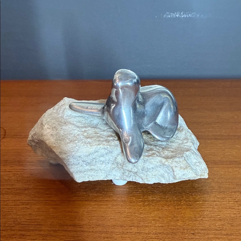 Vintage Hoselton aluminum sculpture of a seal on a stone base